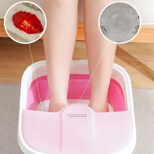 Sklopivi masažer za stopala s vidljivom parom, masažnim valjcima i crvenim LED svjetlima za terapiju.